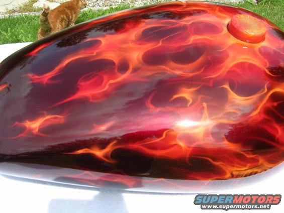 Motorcycle gas tank with red and orange flame paint job