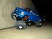 2008 Ford F-250 - A blue 2008 Ford F-250 remote control truck is shown from a three-quarter front angle.