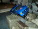 2008 Ford F-250 - A blue Ford F-250 RC truck navigates a rocky obstacle course.