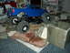 2008 Ford F-250 - RC rock crawler truck navigates a terrain of bricks and concrete blocks.