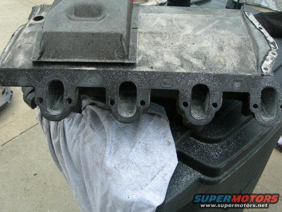 Intake manifold with visible ports and Supermotors.net logo
