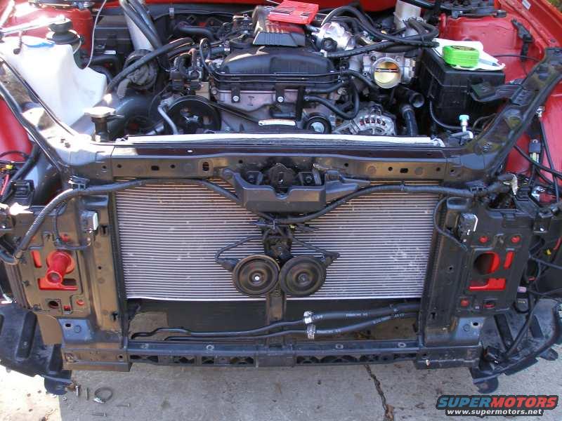2010 Hyundai Genesis engine bay, radiator, hoses, and front frame exposed