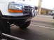 1986 Ford Bronco - Front view of a white truck, possibly a 1992 Ford F-Series, equipped with off-road lights and a custom bumper.