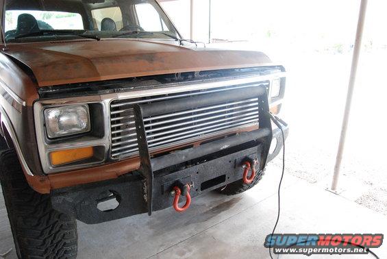 Brown 1982 Ford Bronco front view with custom bumper and grille guard