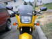2002 Kawasaki Ninja - Front view of a yellow motorcycle with a Ninja logo visible on the windscreen.