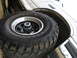 1995 Ford Bronco - Close-up of a Ford Bronco's fender and tire, revealing "ADVENTURO M/T" and "GT RADIAL" branding.