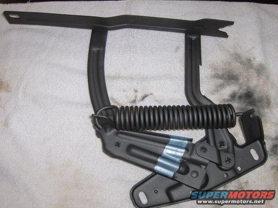Black hood hinge with spring, part of a 1970 Chevrolet Camaro