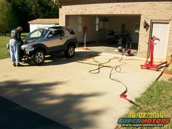 1999 Isuzu Vehicross with hood open, parked in driveway