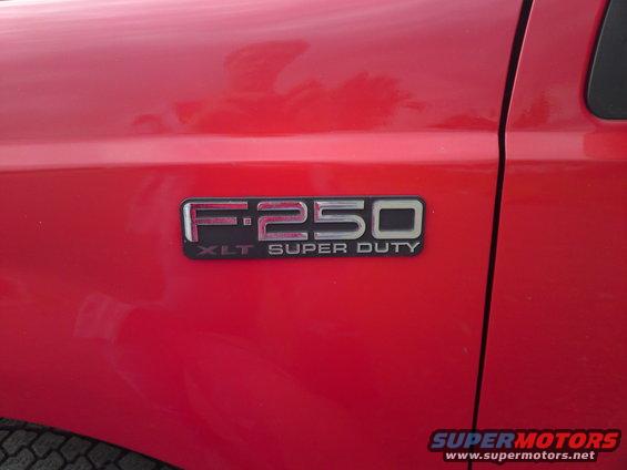 Red Ford F-250 XLT Super Duty fender badge