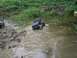 1994 Ford Escort - Toy RC trucks navigating a muddy obstacle course.