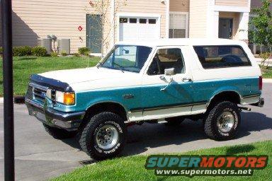 White and teal 1990 Ford Bronco 3/4 front view
