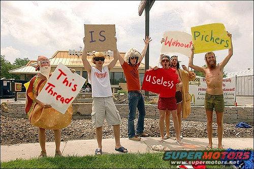 People holding signs that say 'This Thread IS Useless Without Pichers'