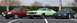 1971 Ford Mustang - Three Ford vehicles are parked in a lot: a 1971 Mustang, a Ford Escort, and a Ford Probe.