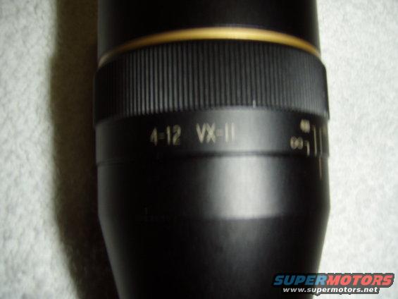 Close-up of a rifle scope with magnification settings 4-12 VX-II