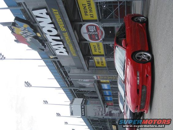Red 1994 Ford Probe parked at Daytona International Speedway, 3/4 front view