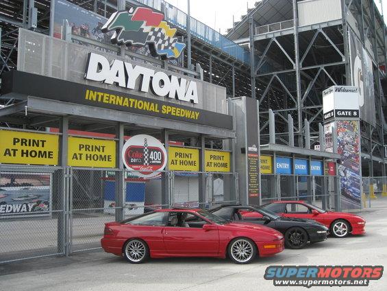Red 1994 Ford Probe parked at Daytona International Speedway