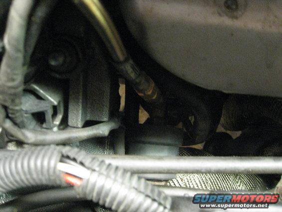 Engine bay with exhaust manifold, wiring, and heat wrap