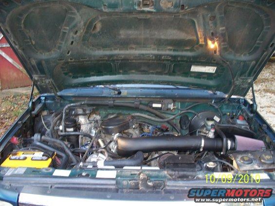 1995 Ford Bronco engine bay showing a K&N cold air intake system installed