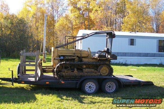 Crawler tractor on a trailer, side view