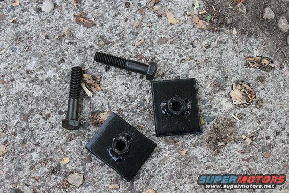 only two bolts mount the main bracket to the crossmember.