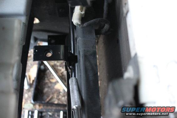 the top bracket will bolt into a bracket that slides under the top of the bumper and bottom of the header panel to mount the top part of the 5040.