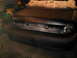 2003 Ford Crown Victoria - The rear of a 2003 Ford Crown Victoria is shown, with the trunk lid covered in newspaper for protection during a painting project.