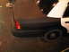 2003 Ford Crown Victoria - Rear view of a 2003 Ford Crown Victoria police car, showing the taillight and rear quarter panel.