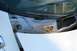 1976 Ford Ranchero - The cowl area of a car shows signs of rust and a wiper assembly.
