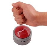 Hand pressing a red button labeled 'BULLSHIT'