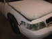 2003 Ford Crown Victoria - This vehicle appears to be undergoing bodywork, with primer and masking tape visible on the front end.
