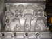 1965 Ford 427 - This is a close-up view of an engine's intake manifold, showing its complex internal structure.