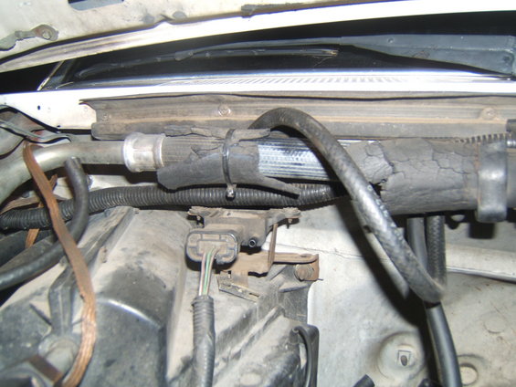 Engine bay with damaged insulation on a hose
