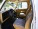 1987 Dodge 1500 - Interior view of a vintage truck, showing the dashboard, steering wheel, and seats.