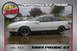 1989 Ford Probe - A white 1989 Ford Probe is shown from the side, aftermarket black wheels and a spoiler.