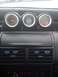 1989 Ford Probe - A close-up view of aftermarket gauges installed in the dashboard of a vehicle, including boost, air/fuel, and oil pressure readings.