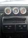 1989 Ford Probe - Aftermarket gauges installed in a car's dashboard, including boost, air/fuel ratio, and oil pressure.
