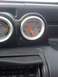 1989 Ford Probe - Dashboard gauges show oil pressure and fuel levels. The oil pressure reading is low.