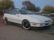 1989 Ford Probe - A white 1989 Ford Probe is shown from a three-quarter front angle, parked on a paved surface.