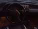 1989 Ford Probe - Interior view of a car, a steering wheel and aftermarket gauges.