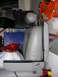 1998 Mercury Grand Marquis - A car seat is shown in a cluttered garage setting, with various storage items and tools visible.
