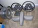 1998 Mercury Grand Marquis - Interior parts including two steering wheels, headrests, and a wheel rim are laid out on a carpeted floor.