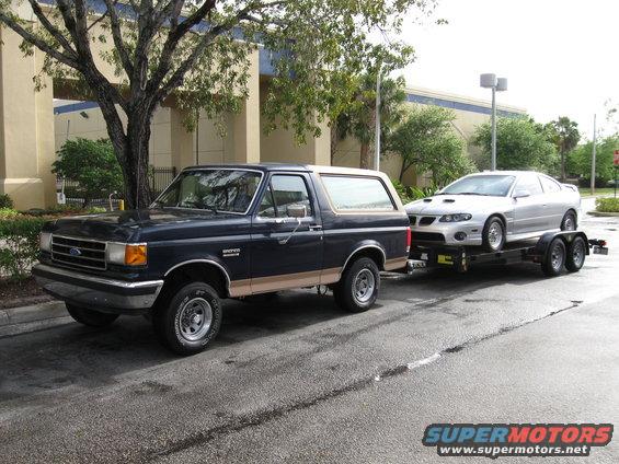 bronco-with-gto-(1).jpg First time towing.  Fully stock Bronco.  Stopped at a gas station before heading to the drag strip with The Silver Hornet (GTO).  