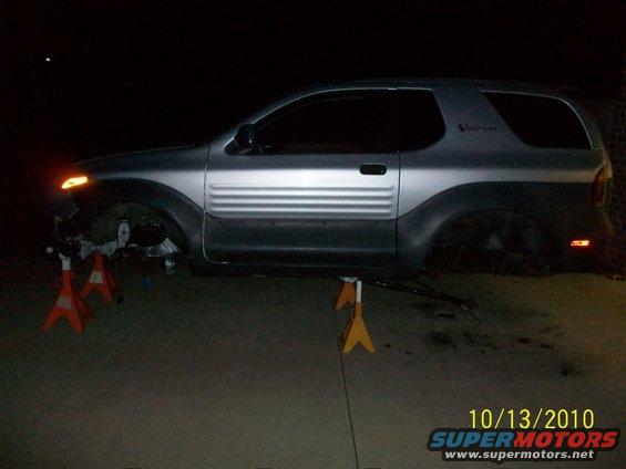 1999 Isuzu Vehicross side view on jack stands, wheels removed