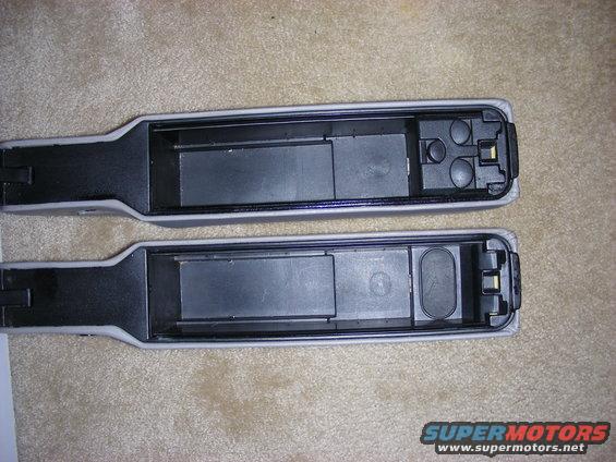 Two gray and black car armrest compartments with open storage bins