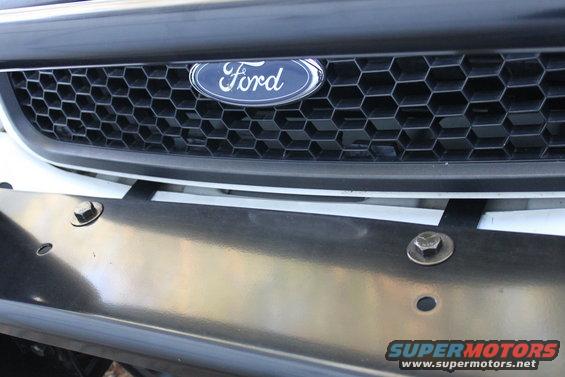 Ford grille with honeycomb pattern and a shiny push bar below