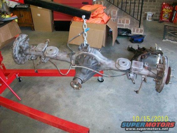 Vehicle rear axle assembly suspended by a chain and engine hoist