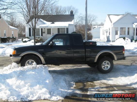 Black 1995 Ford Ranger side view in snow