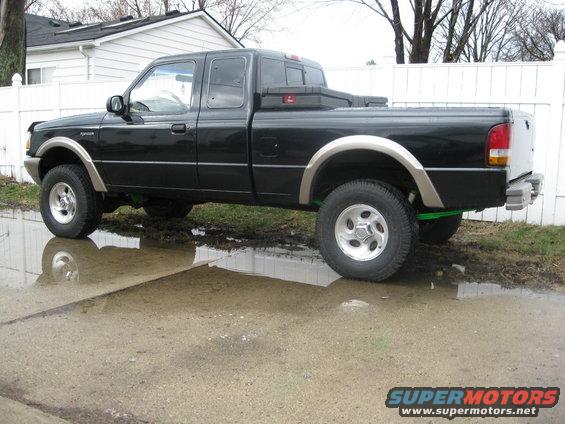 Black 1995 Ford Ranger pickup truck, side view