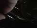 1995 Ford Bronco - A close-up view of an engine oil dipstick being checked.
