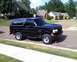 1996 Ford Bronco - Black 1996 Ford Bronco parked on a suburban street.